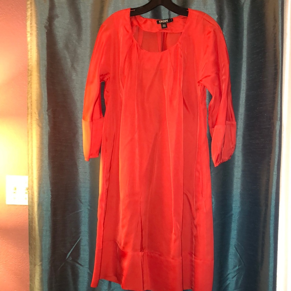 DKNY orangey red dress with pleats at the neck.